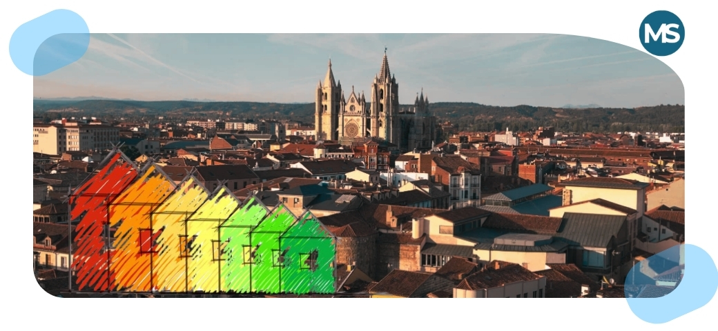 Vista panorámica de León con la Catedral al fondo y representación gráfica del certificado energético de viviendas en distintos niveles de eficiencia.