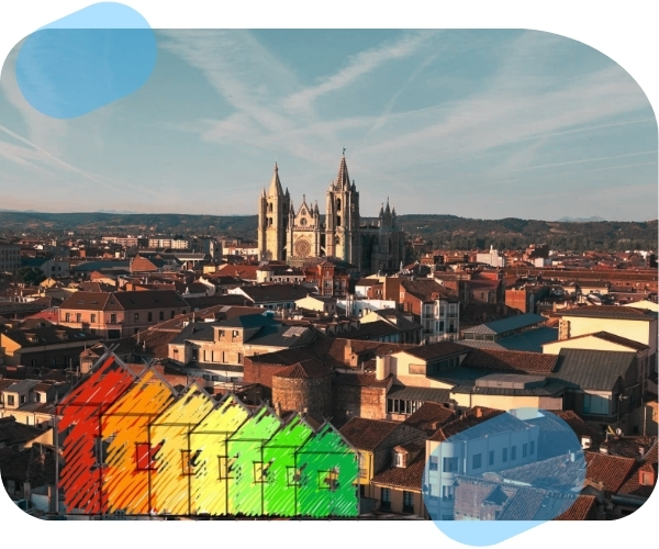 Vista panorámica de León con la Catedral al fondo y representación gráfica del certificado energético de viviendas en distintos niveles de eficiencia.